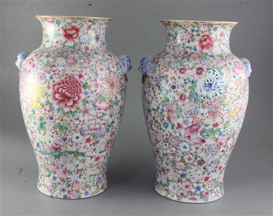 A pair of Chinese thousand flower baluster vases, Republic period, height 40cm excl. wood stands
